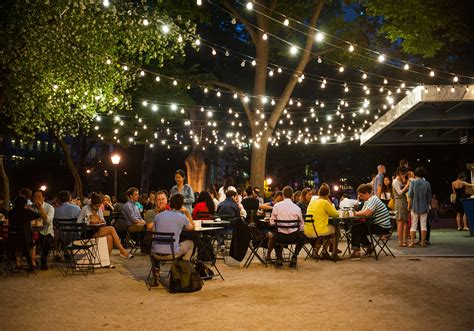 Dining Outdoors Under String Lights | Hometown Evolution Inc.