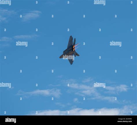 A U.S. Air Force F-22 Raptor conducts a heritage flight during the 2022 ...