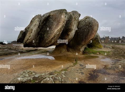 Eroded rock formation by wind erosion at the coast in Saint-Guénolé Stock Photo, Royalty Free ...