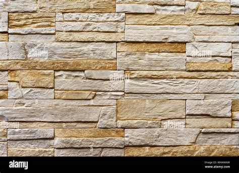 Texture of the stone wall. Panel of stones for finishing the facade of the building and interior ...