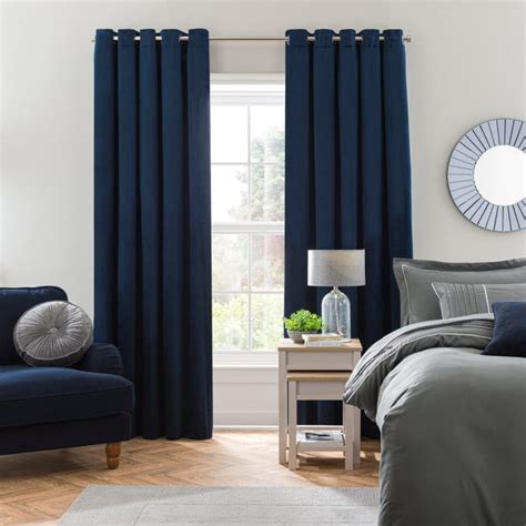 Isla Thermal Blackout Ultra Midnight Blue Eyelet Curtains | Dunelm