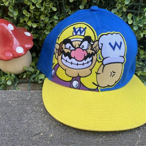 Sick wario hat from 2011 . Blue and yellow .... - Depop