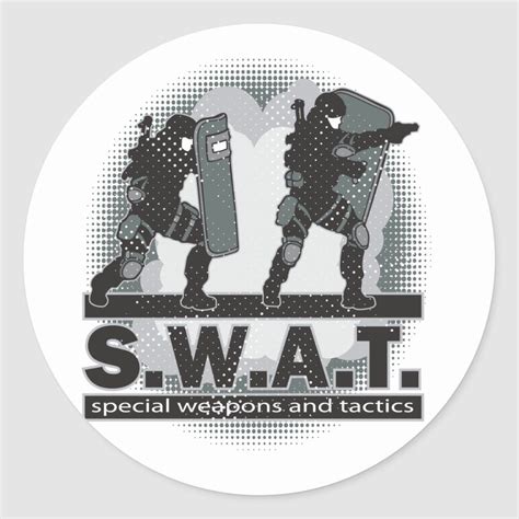 Two heavily armed S.W.A.T. team members with shields get ready for ...