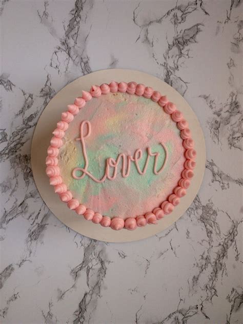 there is a cake with the word love on it and frosting in the shape of a ...