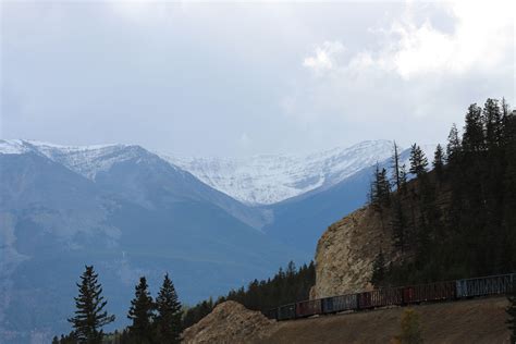 A train traveling through the mountains in the Jasper National Park ...