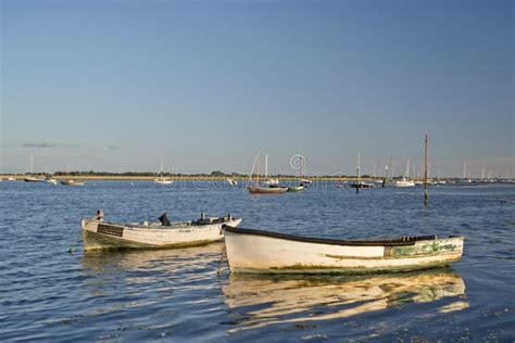 Old Fishing Boats Reflected in Calm Water during Summer Sunset Stock ...