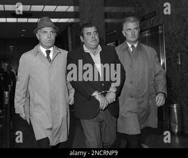 Carmine Tramunti, center, is shown in custody, leaving FBI headquarters ...