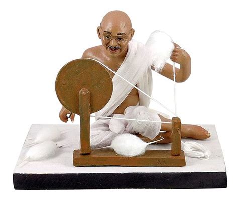 Mahatma Gandhi with his Charkha