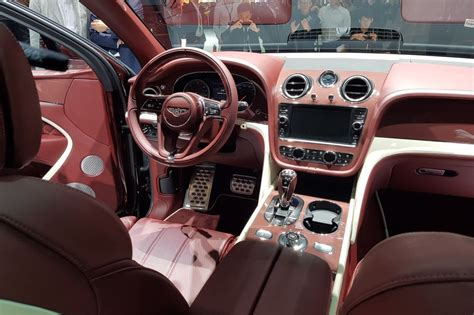 the interior of a car with red leather seats