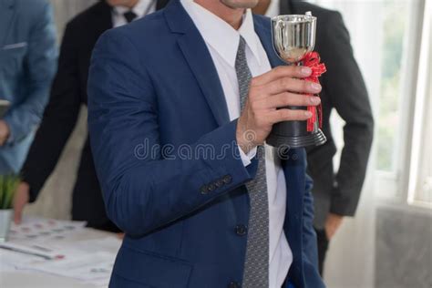 Employee Showing the Trophy Award for Success in Business. Stock Image - Image of competition ...