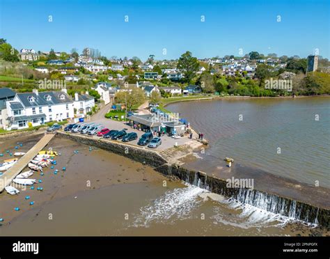 Totnes, UK. 20th Apr, 2023. Water flows over the Mill Pond weir at ...