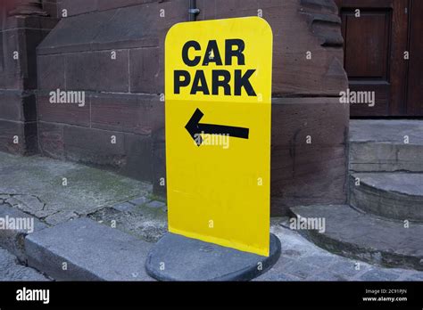 bright yellow car parking sign outside church in Liverpool March 2020 Stock Photo - Alamy