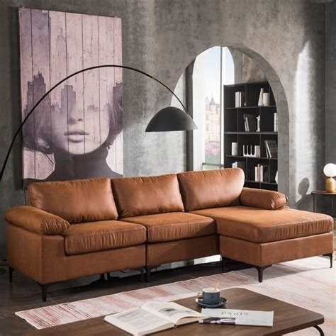 a living room with a sectional couch and coffee table