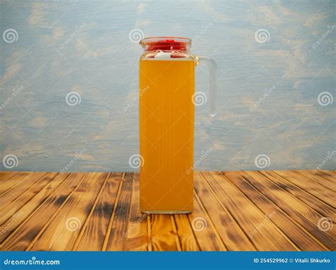 Orange Juice in a Jug. Glass Pitcher and Orange Juice on a Wooden Table. Stock Photo - Image of ...