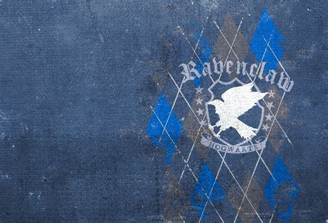 a blue and white pillow with the words ravenclaw on it