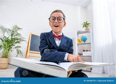 School Nerd with Glasses Points at a Book and Laughs. Back To School Stock Image - Image of ...