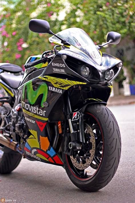 a colorful motorcycle is parked on the street