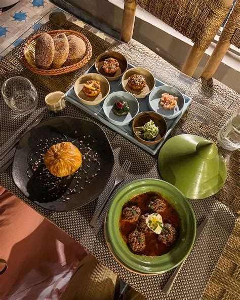 a table topped with plates and bowls filled with different types of ...