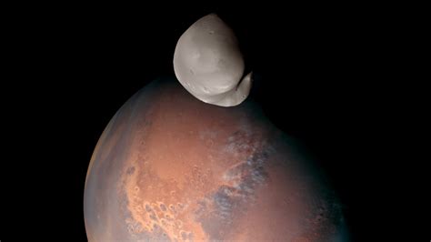 This is our 1st detailed look at Mars' most mysterious moon Deimos ...