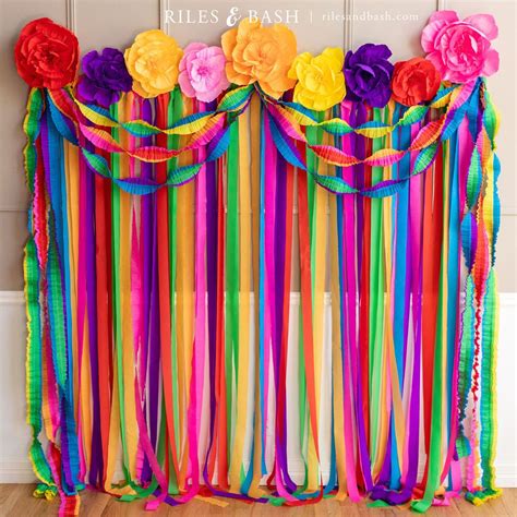 Mexican fiesta streamer backdrop with crepe paper fiesta flowers and ruffled party streamers ...