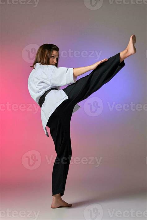 Athletic woman in traditional kimono is practicing karate in studio. 35759804 Stock Photo at ...