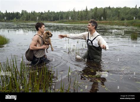 CHAOS WALKING, from left: Tom Holland, Manchee, director Doug Liman, on set, 2021. ph: Murray ...