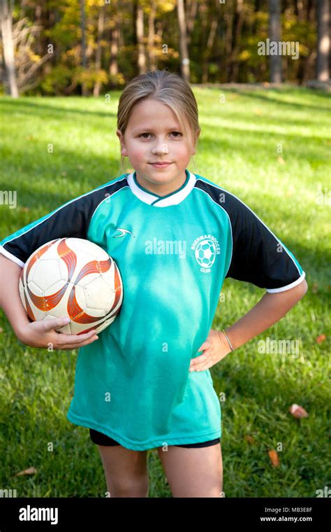 Young Girl Holding Soccer Ball, Close-Up Stock Photo - Alamy