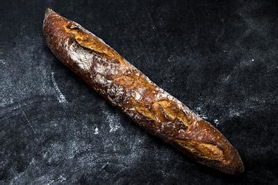 Cut French bread on a brown paper | Free public domain photo - 435293