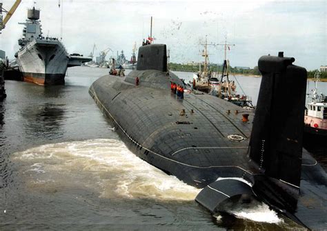 Russian Typhoon class submarine being towed, aircraft carrier Kuznetsov ...