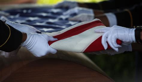 A Military Flag Folding Ceremony/Stars and Stripes Honoring Military ...