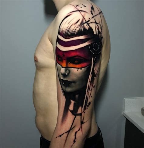 Female warrior portrait tattoo on the upper arm