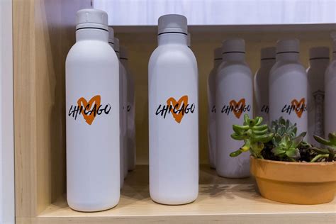 Chicago love sales article for city marathon: White water bottles with orange heart symbol ...
