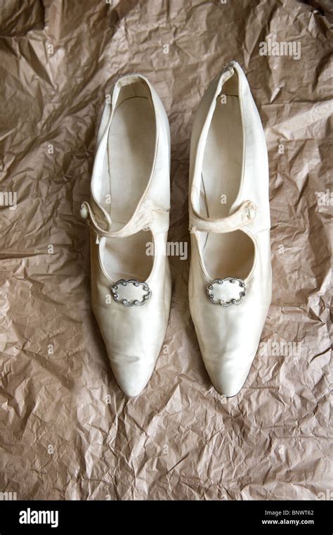 A pair of vintage white satin shoes Stock Photo - Alamy