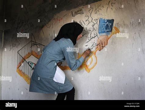 Duma, West Bank, Palestinian Territory. 7th Sep, 2015. A Palestinian girl paints a graffiti on ...