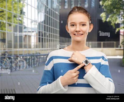 teenage girl showing smart watch with qr code Stock Photo - Alamy