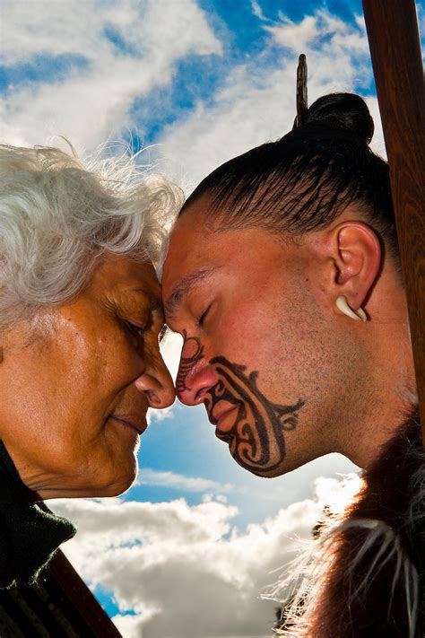 A Maori man with ta moko (facial tattoo) and an elderly Maori woman ...