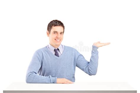 Man Sitting on a Table and Gesturing with His Hand Stock Image - Image ...