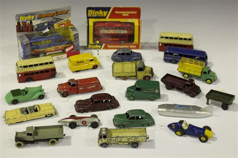 A collection of Dinky Toys cars, commercial vehicles and public transport vehicles, including a No.