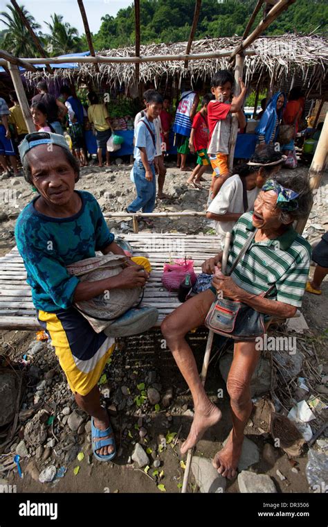 Hanunoo Mangyan men at a Mangyan market near Mansalay, Oriental Mindoro ...