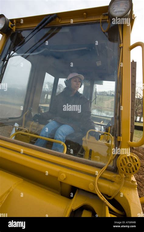 Female bulldozer operator Stock Photo - Alamy