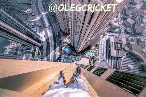 Parkour Traceur Oleg Cricket Makes an Insane Series of Jumps From Ledge to Ledge High on a ...