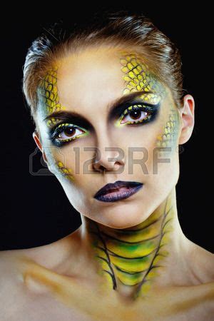 Attractive young woman in makeup snake shot in the studio | Animal makeup, Dragon makeup ...