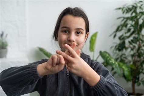 Beautiful Smiling Deaf Girl Using Sign Language. Stock Photo - Image of ...