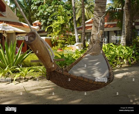 Hammock among the palm trees in one of luxury resorts on Maenam beach, Koh Samui island ...