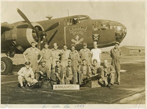 Armament crew posing in front of B-25 Mitchell bomber at Chatham Field in Savannah, Georgia in ...