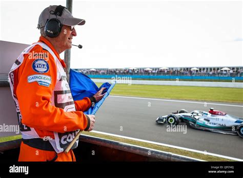 Silverstone, UK. 1st July, 2022. Marshal with blue flag, F1 Grand Prix ...