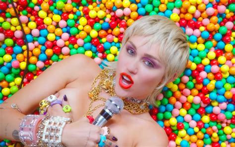 Miley Cyrus Wearing Colourful Jewellery in "Midnight Sky" | Miley Cyrus's Designer Outfits in ...