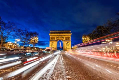 Arc de Triomphe Streaming Traffic at Night - Travel Caffeine