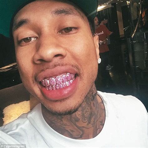 Tyga showcases his new diamond encrusted smile with the help of pink grillz | Daily Mail Online