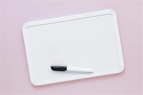 Free Photo | Flat lay whiteboard with marker on top